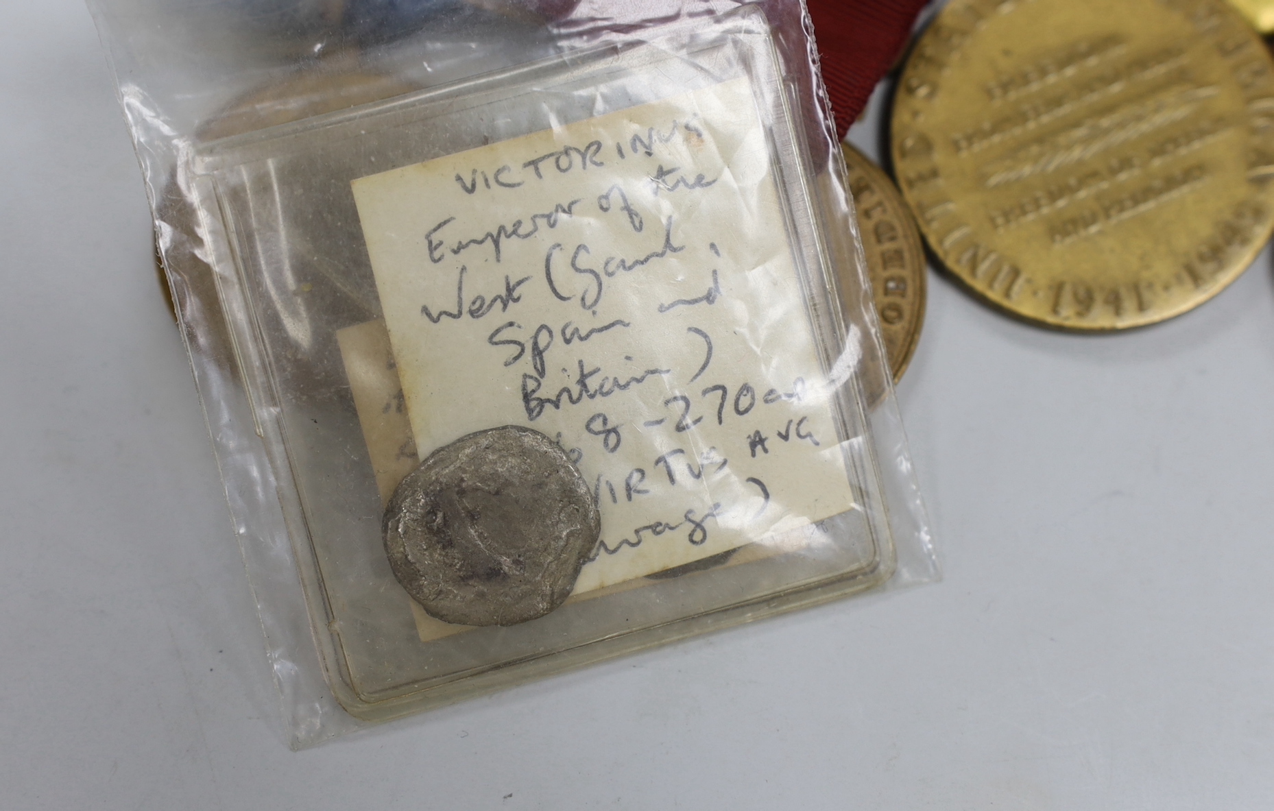 A collection of American WWII medals, including a Purple Heart, unnamed